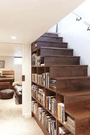 A bookshelf built into and underneath a staircase