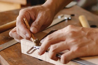 A photograph of craftsman hands working on new cabinets for a kitchen remodel in Colorado Springs, Colorado for Homefix