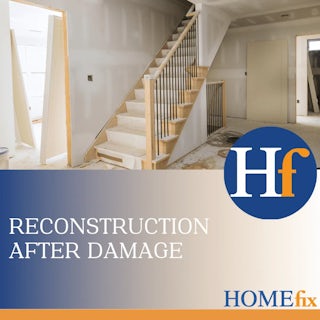 A photograph of a home under reconstruction with drywall walls and new stairs