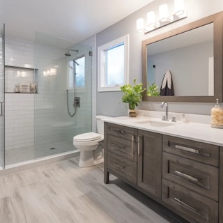 A brand new bathroom remodel with natural light tones